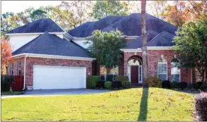  ?? PHOTOS BY LINDA GARNER-BUNCH/Arkansas Democrat-Gazette ?? This Woodlands Edge home has four bedrooms, three-and-a-half baths, a study, a bonus room/ playroom and more. The large lot borders a permanent wooded green space.