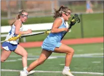  ?? KYLE FRANKO — TRENTONIAN PHOTO ?? Notre Dame’s Stella Scudillo (12) runs with the ball against Princeton during a CVC girls lacrosse game earlier this season.