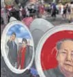  ?? AFP ?? A Tiananmen Square shop with plates featuring President Xi Jinping and his wife, and former leader Mao Zedong.