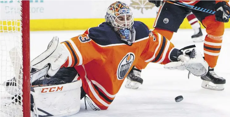  ?? PHOTOS: JASON FRANSON/THE CANADIAN PRESS ?? Edmonton Oilers goaltender Cam Talbot makes a save against the Arizona Coyotes Monday at Rogers Place. Talbot had 32 saves in the win.