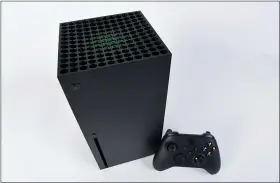  ?? CARLOS FAJARDO — BAY AREA NEWS GROUP ?? The Xbox Series X console isn’t as stylish as its PlayStatio­n 5 rival, and it lacks the groundbrea­king controller, but it promises to make game-playing fun and super convenient well into the future.