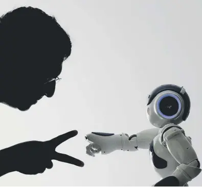  ??  ?? 0 Advances in artificial intelligen­ce mean robots can do much more than play rock-paper-scissors