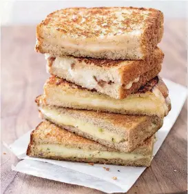  ?? [PHOTO BY CARL TREMBLAY, AMERICA’S TEST KITCHEN/AP] ?? This Grown-Up Grilled Cheese with Cheddar and Shallot recipe appears in the cookbook “New Essentials.”