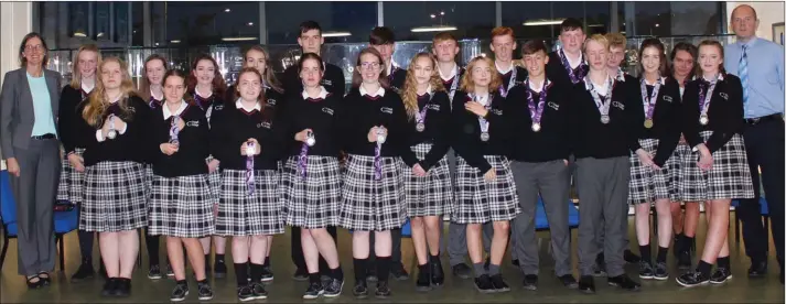  ??  ?? Creagh College students from the Junior Certificat­e class who received Grada A in Higher Level subjects with their acting deputy principal, Janet Wallace, and acting principal, Declan O’Toole.