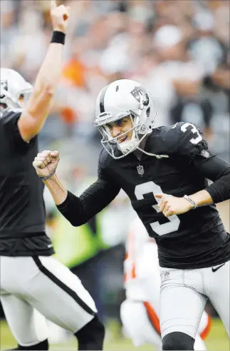  ?? D. Ross Cameron ?? The Associated Press Raiders kicker Matt Mccrane (3) is jubilant after kicking the winning 29-yard field goal in overtime in a 45-42 victory Sunday over the Cleveland Browns in Oakland, Calif.