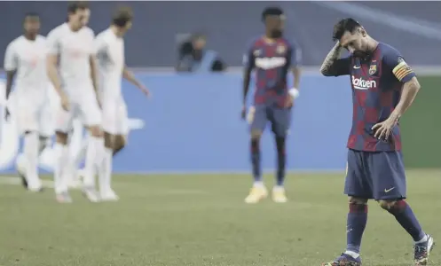  ?? PICTURE: MANU FERNANDEZ/AP ?? 0 Lionel Messi hangs his head in anguish during Barcelona’s 8-2 destructio­n by Bayern Munich.