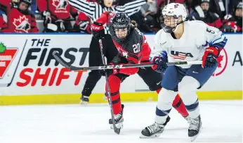  ?? LIAM RICHARDS/THE CANADIAN PRESS ?? Canadian forward Sarah Nurse races against U.S. defenceman Megan Bozek as the titans of women’s hockey faced off once again Wednesday, with the Americans coming out on top.