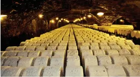  ??  ?? IT’S HOW THEY ROLL: Cheese ripening in the caves of Roqueforts­ur-Soulzon. Above: The sheep that provide the vital ingredient