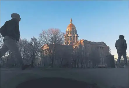  ?? RJ Sangosti, The Denver Post ?? Morning sun rays light the Colorado Capitol last week in Denver.