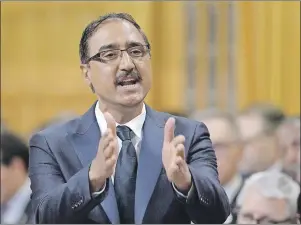  ?? CP PHOTO ?? Minister of Infrastruc­ture and Communitie­s Amarjeet Sohi responds to a question during question period in the House of Commons on Parliament Hill in Ottawa on Monday, June 5. The Trudeau government is telling provinces and territorie­s that billions in...