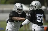  ?? ERIC RISBERG — THE ASSOCIATED PRESS ?? Raiders linebacker Brandon Marshall, left, has been impressed with the mature comportmen­t of the team’s first-round draft picks.
