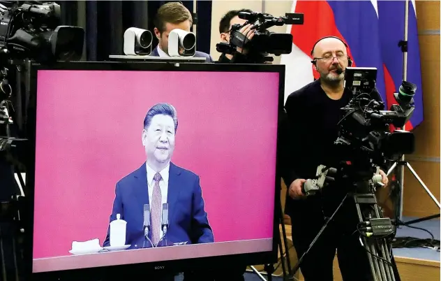  ?? Associated Press ?? ↑
Chinese President Xi Jinping attends a joint video conference with Russian President Vladimir Putin. China and Russia on Monday launched a gas pipeline.