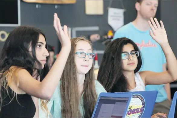  ?? KIM STALLKNECH­T ?? Teens take part in a Microsoft-hosted YMCA youth camp with Ladies Learning Code. The course covered HTML and CSS, two widely used programmin­g languages.