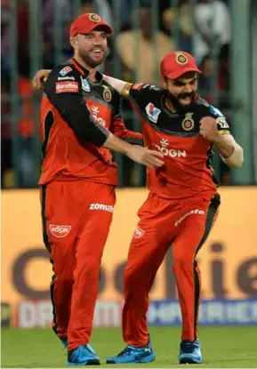  ?? ?? TEAM MATES: AB de Villiers and Virat Kohli (right) were on the same side at Indian Premier League franchise Royal Challenger­s Bangalore.