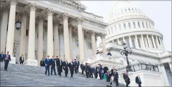  ?? AP PHOTO ?? President Donald Trump walks down the steps of the Capitol building after a luncheon with Irish Prime Minister Leo Varadkar in Washington. From left, Speaker of the House Rep. Paul Ryan, R-Wis., Varadkar, Trump, Rep. Peter King, R-N.Y., and Vice...