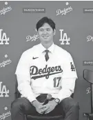  ?? ASHLEY LANDIS/AP ?? The Dodgers’ Shohei Ohtani answers questions during a news conference at Dodger Stadium on Dec. 14 in Los Angeles.