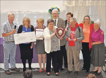  ??  ?? Volunteers from Hope Kitchen were on hand to receive their Organisati­on of the Year award from Michael Russell, MSP.