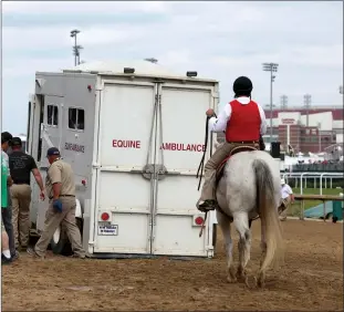  ?? Tribune News Service ?? In this photo from May 6, 2023, an equine ambulance carrying race horse Here Mi Song is driven off the track after racing in the tenth race ahead of the 149th Kentucky Derby at Churchill Downs in Louisville.