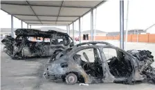  ?? News Agency (ANA) | DOCTOR NGCOBO African ?? THE burnt-out shells of a taxi and car which were involved in one of two horror collisions at the weekend. A total of 15 people died in the two vehicles.