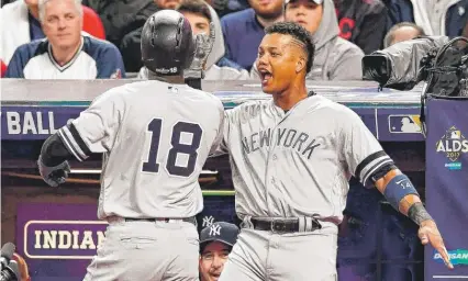  ?? | GETTY IMAGES ?? The Yankees’ Didi Gregorius ( 18) celebrates his two- run homer with Starlin Castro in the third inning against the Indians.