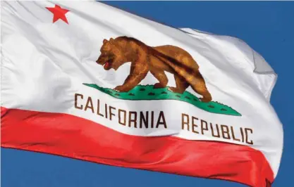  ?? — AFP ?? CALIFORNIA: The California State flag flies outside City Hall, in Los Angeles, California. A campaign by California­ns to secede from the rest of the country over Donald Trump’s election is gaining steam with supporters given the green light to start...