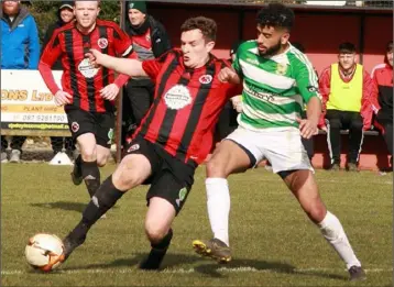  ??  ?? Gavin O’Brien of Gorey Rangers gets to the ball ahead of Jordan Loftus (Castlebar Celtic).