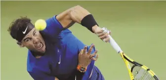  ?? AP PHoto ?? OVER-THE-TOP EFFORT: Rafael Nadal serves on the way to his 14th consecutiv­e victory, beating Fabio Fognini 6-3, 6-1 yesterday to reach the quarterfin­als of the Shanghai Masters.