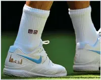  ?? AFP ?? Footnote: Nike still supply Federer’s shoes, with the London skyline and number of his previous Wimbledon titles