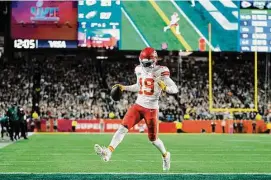  ?? Abbie Parr/Associated Press ?? Chiefs wide receiver Kadarius Toney scores a touchdown against the Eagles during the second half of Super Bowl 57 Sunday in Glendale, Ariz.