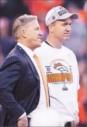  ?? Jamie Squire Getty Images ?? JOHN ELWAY and Peyton Manning celebrate after the Denver Broncos defeated the New England Patriots in the AFC championsh­ip game.