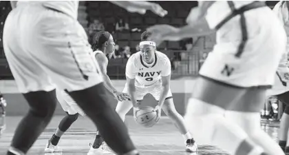  ?? JOSHUA MCKERROW/BALTIMORE SUN MEDIA GROUP ?? Navy’s Jennifer Coleman looks to make a play against North Carolina A&amp;T in the Navy Classic tournament at the Naval Academy. Coleman, a freshman, scored a team-high 20 points, including 14 in the decisive third quarter when the Mids outscored the Aggies 25-8.