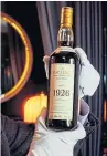  ??  ?? Top: Edrington Group chief executive Scott McCroskie. Above: A bottle of The Macallan 1926 sold for more than £800,000 last year.