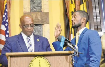  ?? KEVIN RICHARDSON/BALTIMORE SUN ?? Baltimore Mayor Bernard C. “Jack” Young and City Council President Brandon Scott say they are working together, but observers say there is a tension between them, as seen in some of their interactio­ns. In this May 6 photo, Young, left, and Scott, right, at the swearing-in ceremony after Scott’s fellow council members elected him president.