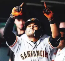  ?? Bay Area News Group/tns ?? Donovan Solano of the San Francisco Giants celebrates a sixth inning solo homer against the Colorado Rockies at Coors Field on Wednesday in Denver.