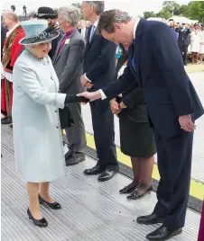  ?? Reuters ?? Democracy bows to Royalty! Britain’s Queen Elizabeth greets Prime Minister David Cameron at the Magna Carta 800th Anniversar­y Commemorat­ion event in Runnymede, Britain. —