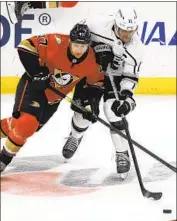  ?? Alex Gallardo Associated Press ?? THE KINGS’ Anze Kopitar, right, and the Ducks’ Hampus Lindholm meet f ive times in 12 days.
