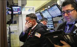  ?? SPENCER PLATT/GETTY IMAGES ?? The Dow fell more than 700 points this week as investors’ fears increased over a potential trade war between China and America.