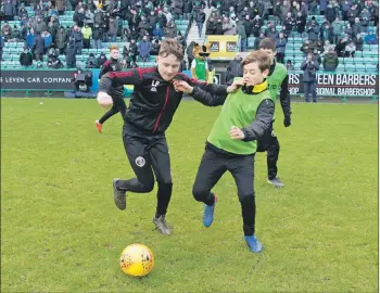  ??  ?? Lorne Paterson jostles with Raphael MacLachlan for possession of the ball.