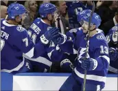  ?? CHRIS O’MEARA — THE ASSOCIATED PRESS ?? Tampa Bay’s Cedric Paquette, right, celebrates the go-ahead goal Thursday night against Buffalo as the Lightning held on to end the Sabres’ 10-game win streak.