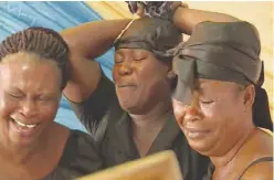  ??  ?? The Ghanaian women paid to cry at funerals