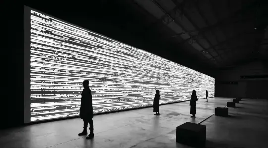  ??  ?? Ryoji Ikeda, Data-flux, 2017; 12 video projectors, computer, speakers; 41.3 x 4.5 x 36 m. © Ryoji Ikeda Studio.