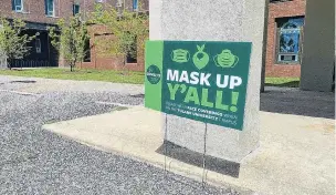  ?? PHOTO: REUTERS ?? Y’all listen now . . . A sign reminds people to wear masks to prevent the spread of Covid19 at Tulane University in Louisiana.