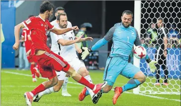  ?? Picture: GETTY IMAGES ?? CLOSE THING: Aleksandr Erokhin of Russia, left, and Stefan Marinovic of New Zealand battle for the ball during the Group A Fifa Confederat­ions Cup match between Russia and New Zealand at St Petersburg Stadium on Saturday
