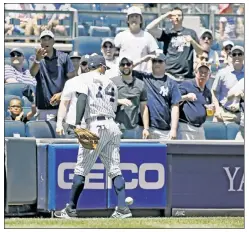  ?? Paul J. Bereswill; Bill Kostroun ?? NOT A SUNNY OUTLOOK: Ronald Torreyes loses the ball in the sun in the first inning Saturday at Yankee Stadium, as manager Joe Girardi (inset) witnessed his Yankees losing for the ninth time in their past 11 games.