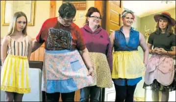  ?? Iain Woessner/ Times-Record ?? Audrey Lahlum’s apron collection features a lot of varieties and styles. Above a line of models showcases her aprons. RIGHT: Myra Helm’s homemade treats for Saturday’s tea party.