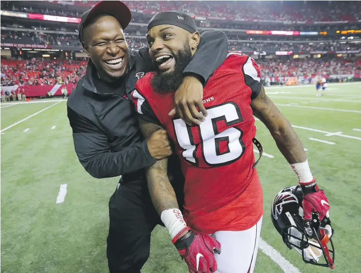  ?? — THE ASSOCIATED PRESS FILES ?? Atlanta Falcons wide receivers coach Raheem Morris and receiver Justin Hardy celebrate a 36-20 win over the Seattle Seahawks Saturday in Atlanta.