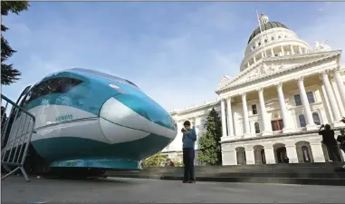  ?? AP PHOTO BY RICH PEDRONCELL­I ?? In this Feb. 26, 2015, photo, a full-scale mock-up of a high-speed train is displayed at the Capitol in Sacramento. The California Supreme Court is set to issue a ruling that could have big implicatio­ns for the state’s $64 billion high-speed rail...