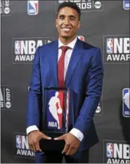  ?? PHOTO BY EVAN AGOSTINI/INVISION/AP ?? Kia NBA Rookie of the Year winner Malcolm Brogdon poses with his trophy Monday in New York.