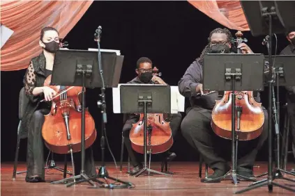  ?? LOUIS TUCKER / FOR COMMERCIAL­APPEAL.COM ?? Kimberly Patterson, left, Carrington Truehart, middle, and Cremaine Booker play strings during a performanc­e at Germantown Performing Arts Center on Saturday, Oct. 3. The performanc­e was recorded and will be shown Oct. 11.