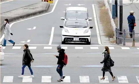  ?? (Toru Hanai/Reuters) ?? AN EASY RIDE self-driving vehicle, based on the Nissan Leaf, is seen during its media preview in Yokohama last week. Automakers are looking for ways to profit from the rise of car-sharing services, which along with self-driving cars, are likely to lead...